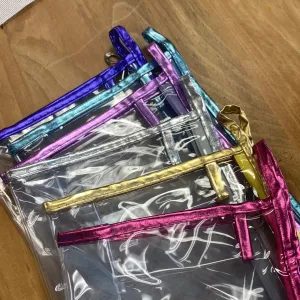 Clear bags with soft metallic trim